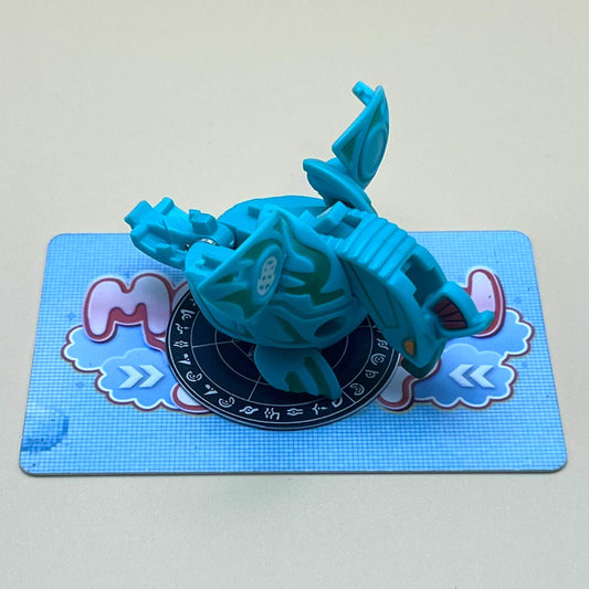 A blue toy figure is sitting on a blue and white checkered card.