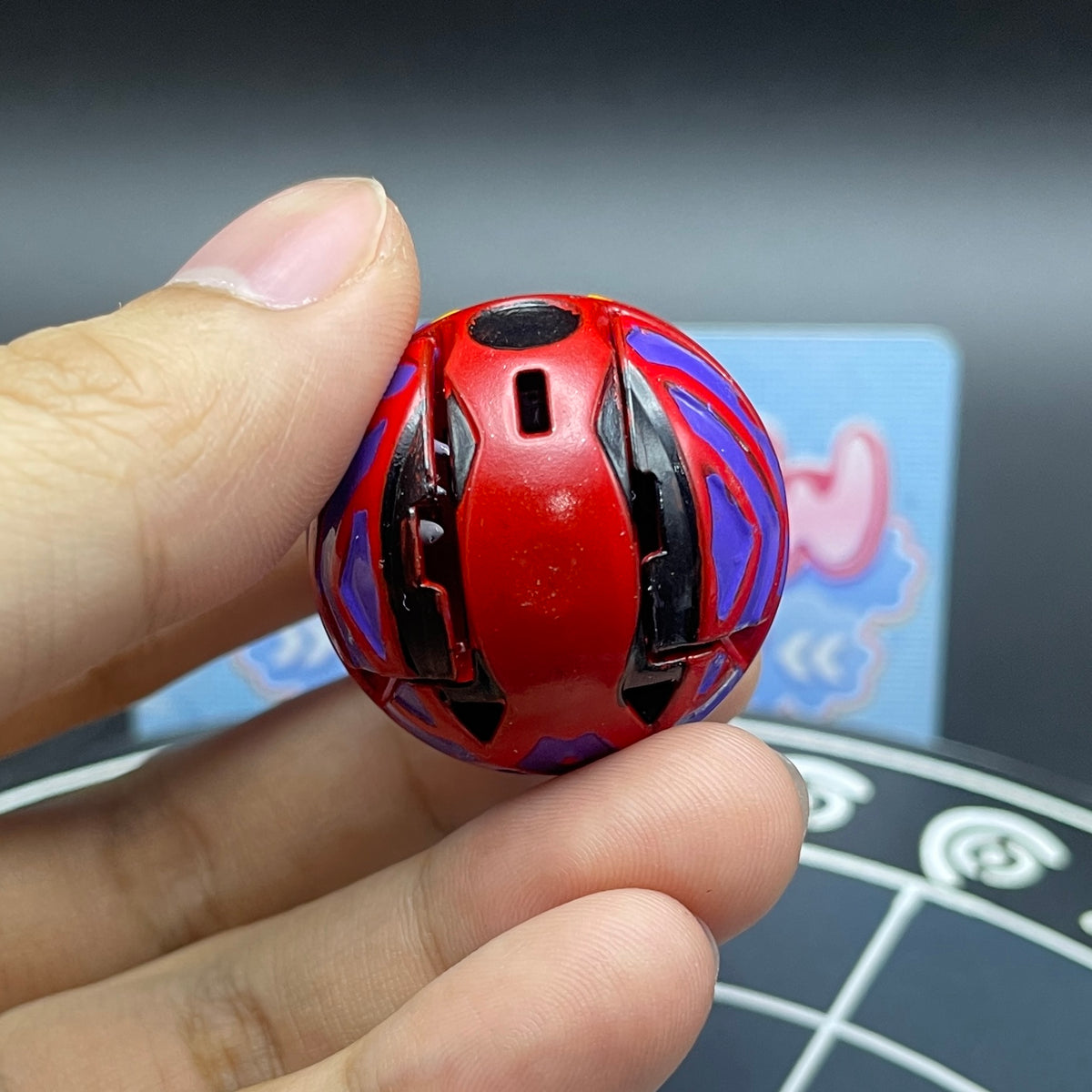 Close-up view of the Druman Bakugan toy folded into its sphere marble mode.