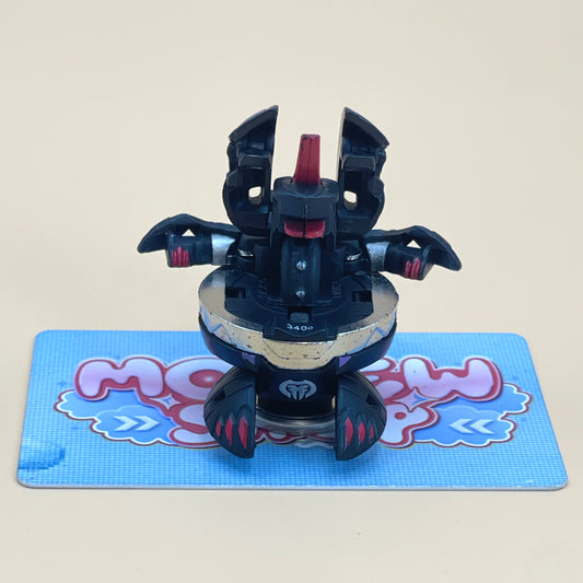 A toy robot with a black and red color scheme is sitting on a blue and white checkered surface.