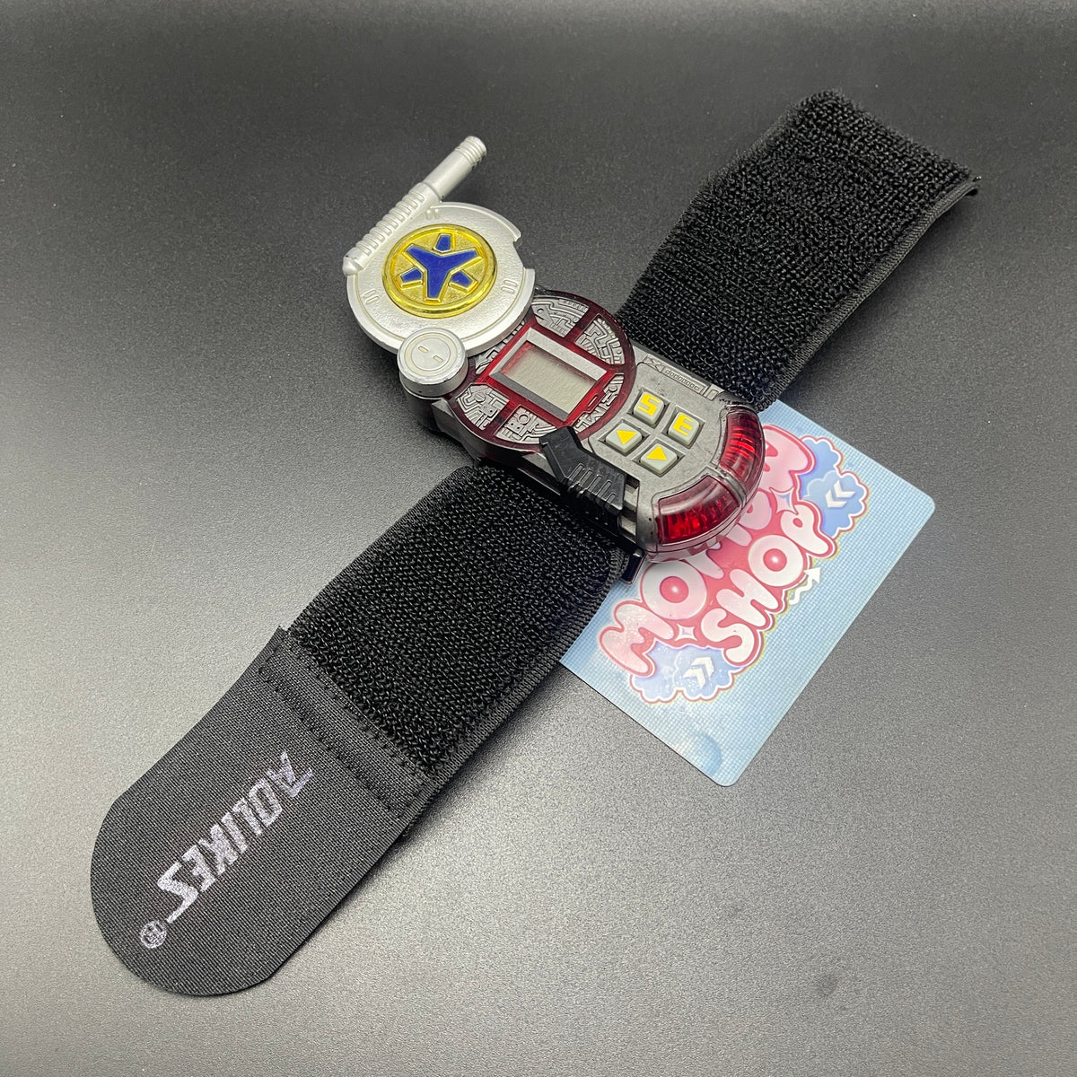 Power Rangers Lightspeed Rescue Rescuer Morpher attached with an replacement wrist strap fully extended.
