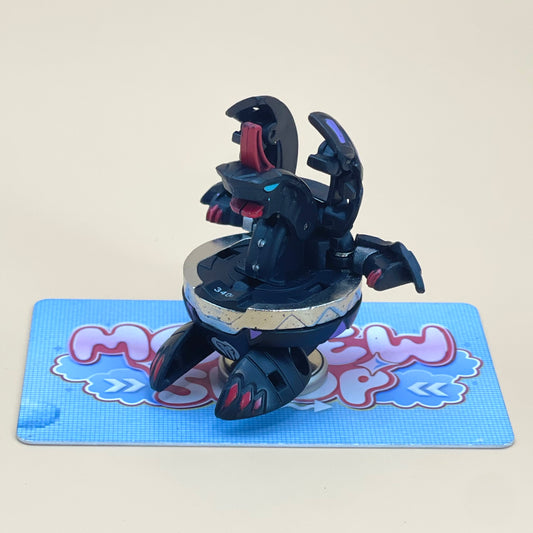 A toy figure of a black and red monster with a large mouth and open arms, sitting on a blue and white checkered surface.