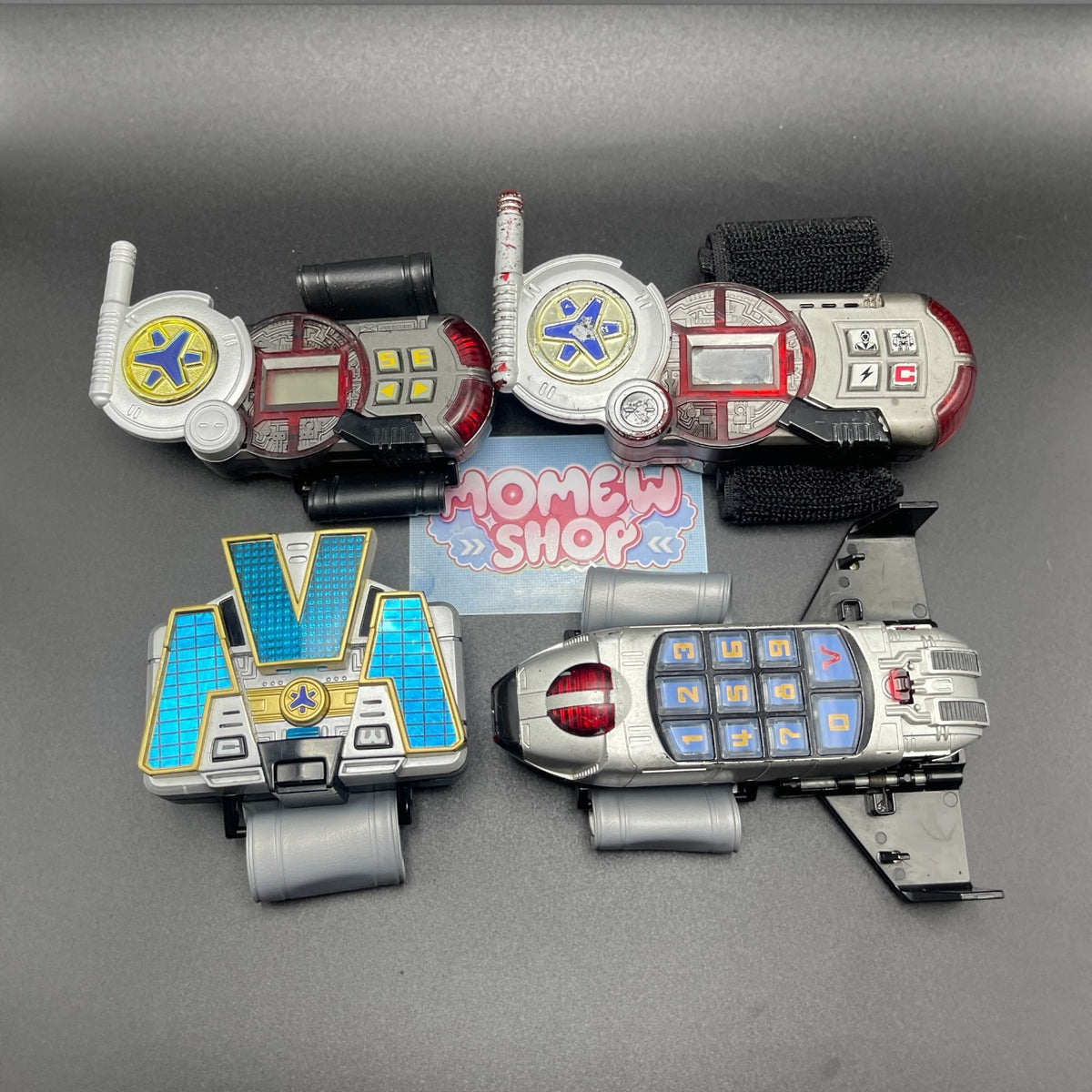 Complete set of Power Rangers Lightspeed Rescue morphers and weapons including Rescuer Morpher and Titanium Morpher in deployed mode.