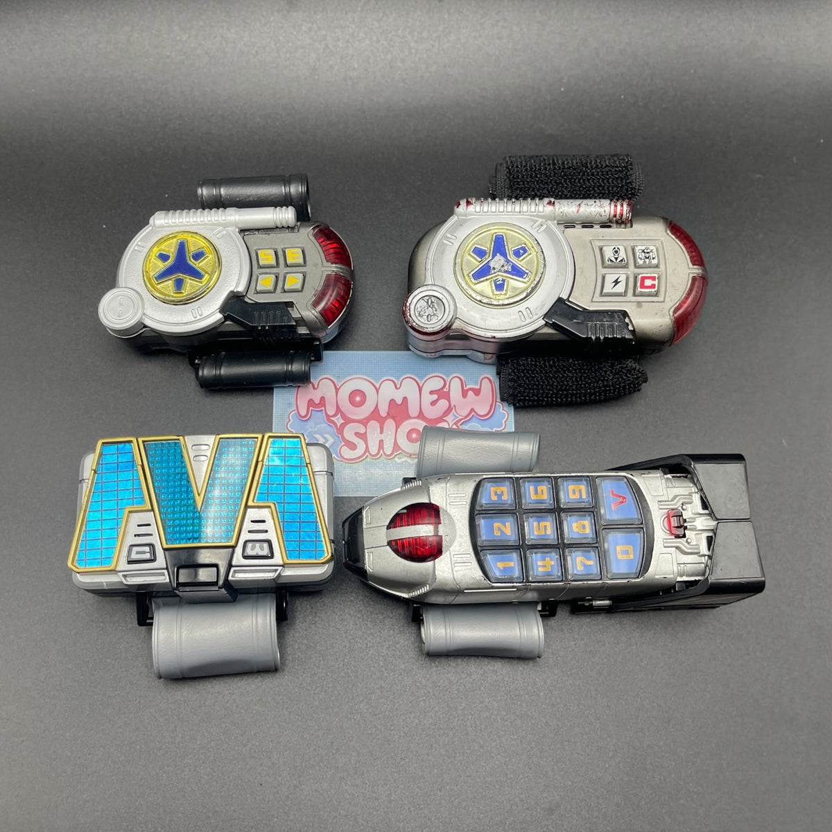 Full collection of Power Rangers Lightspeed Rescue electronic roleplay toys and morphers in standard closed configuration.