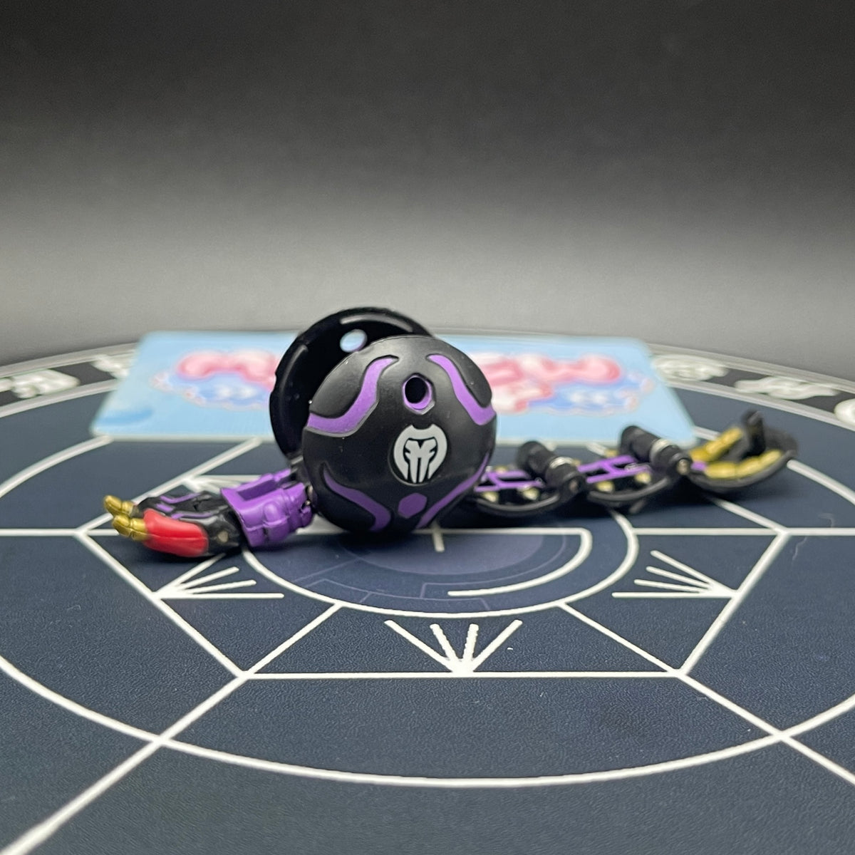 Darkus B1 Centipoid Bakugan Battle Brawlers opened monster form front view in black and purple colors.