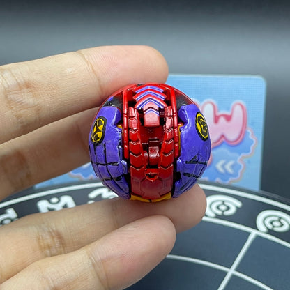 Custom painted Druman Bakugan in ball form held in hand for scale and display.