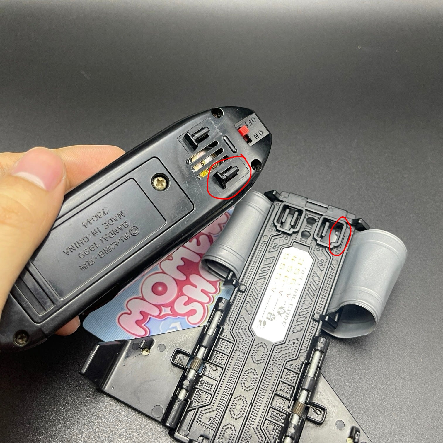 Back view of the Power Rangers Lightspeed Rescue Battle Booster Morpher showing battery compartment and strap.