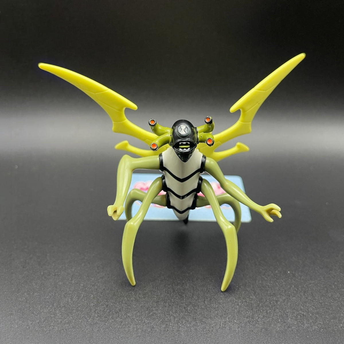 Ben 10 Classic Stinkfly Battle Version insect alien action figure front view with large yellow wings.