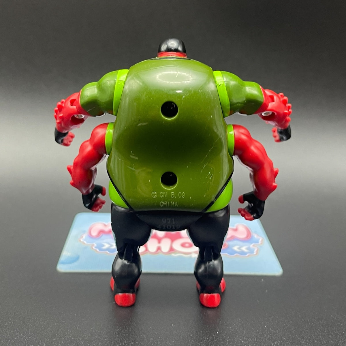 Back view of Gorvan action figure from Ben 10 Alien Force showing four-arm structure and green shell back.