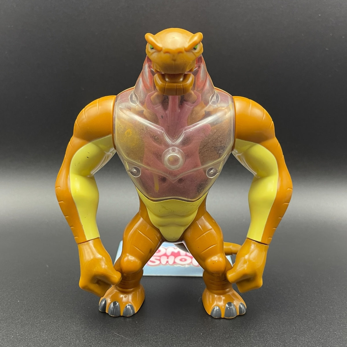 Front view of the Ben 10 Humungousaur action figure showing its translucent chest detail.