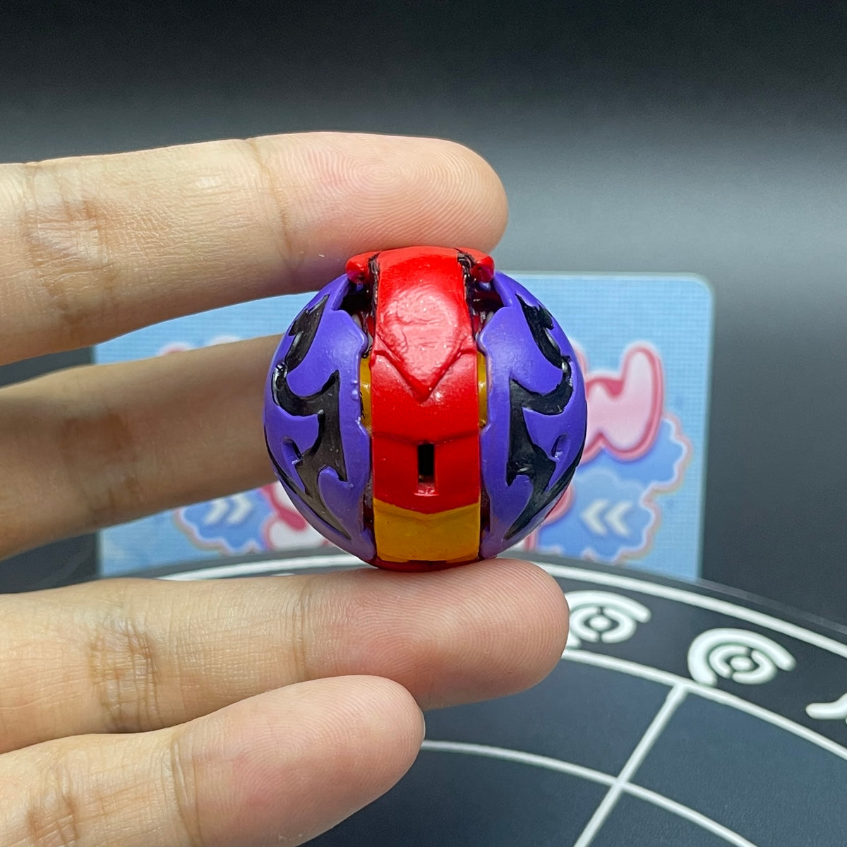 Close-up view of the Drugan Bakugan toy folded into its sphere marble mode.