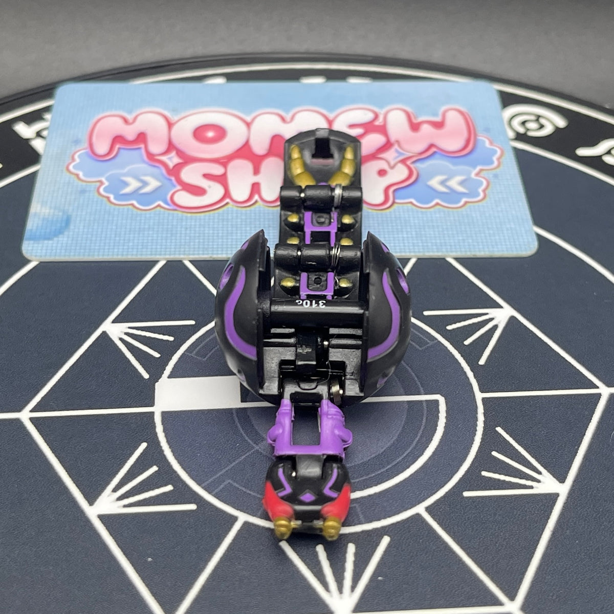 Top view of opened Darkus B1 Centipoid Bakugan figure showing body segments and details.
