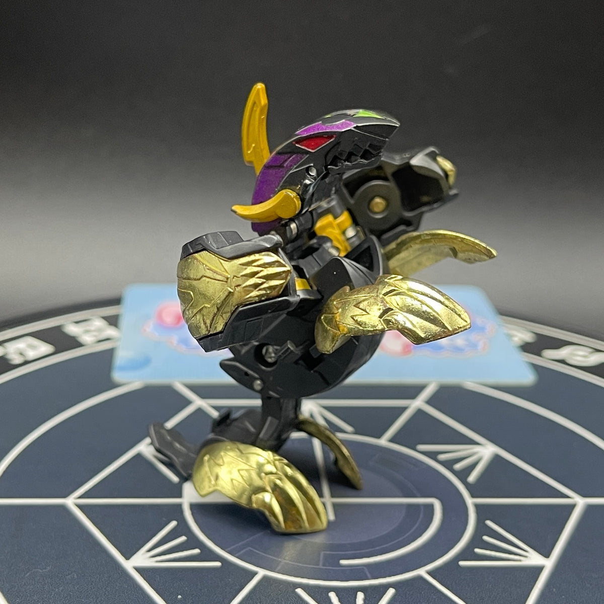 Full opened view of Darkus Seis Tavanel Metal Cross Baku Tech Bakugan figure.