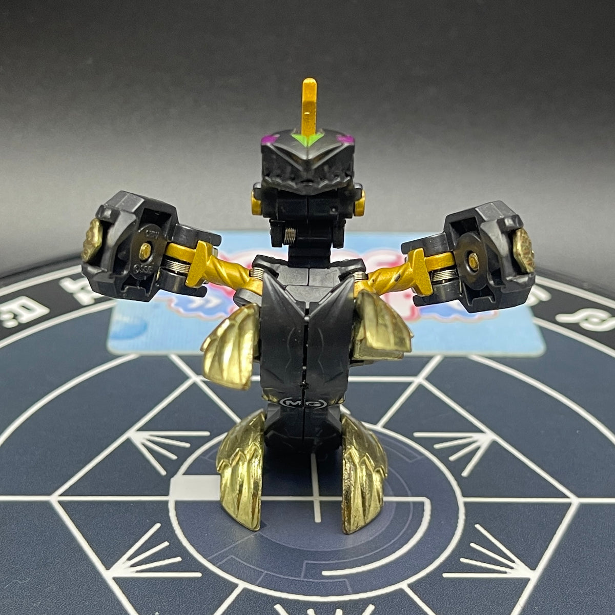 Front straight view of opened Darkus Seis Tavanel Metal Cross Baku Tech Bakugan figure.