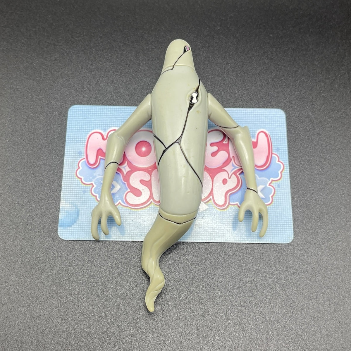 Rear perspective view of the Ben 10 Classic Ghostfreak action figure displaying tail details.