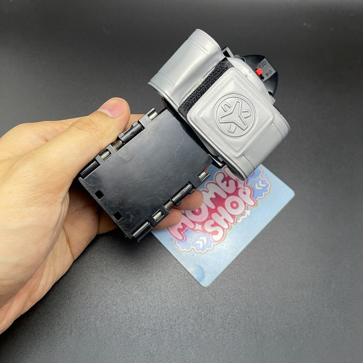 Hand holding the Power Rangers Lightspeed Rescue Battle Booster Morpher toy.