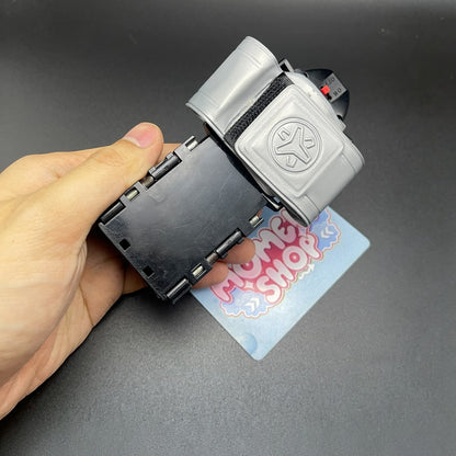 Hand holding the Power Rangers Lightspeed Rescue Battle Booster Morpher toy.