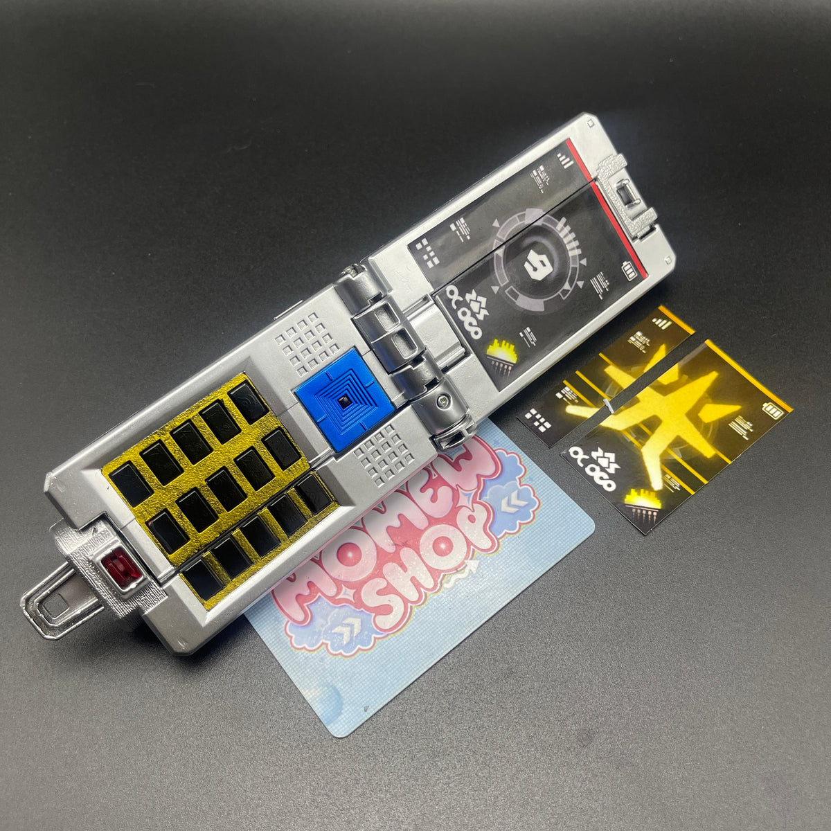 Opened view of Samurai Gold Morpher prop replica from Power Rangers Samurai with sticker sheet.