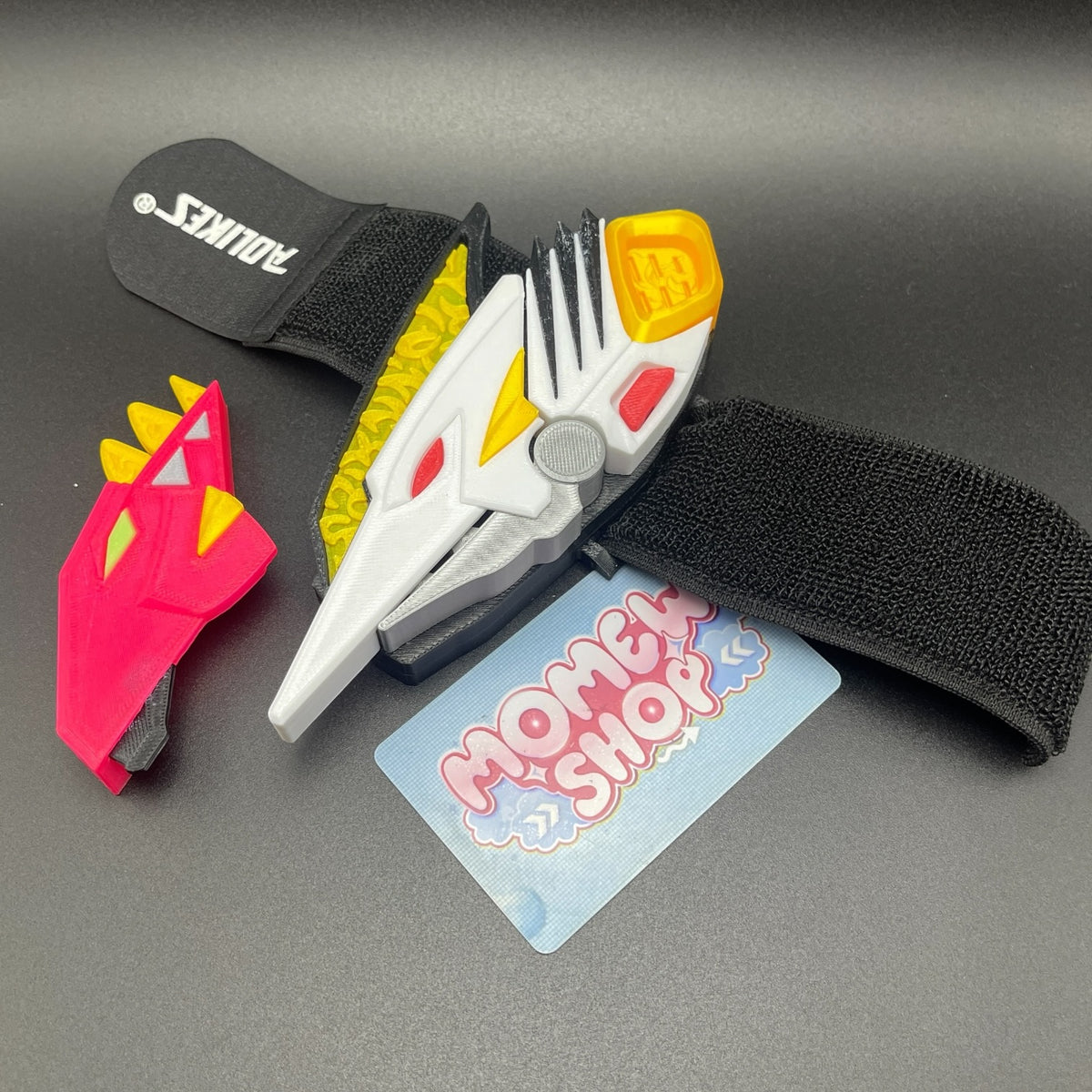Assembled White Drago Morpher prop attached to wrist strap.