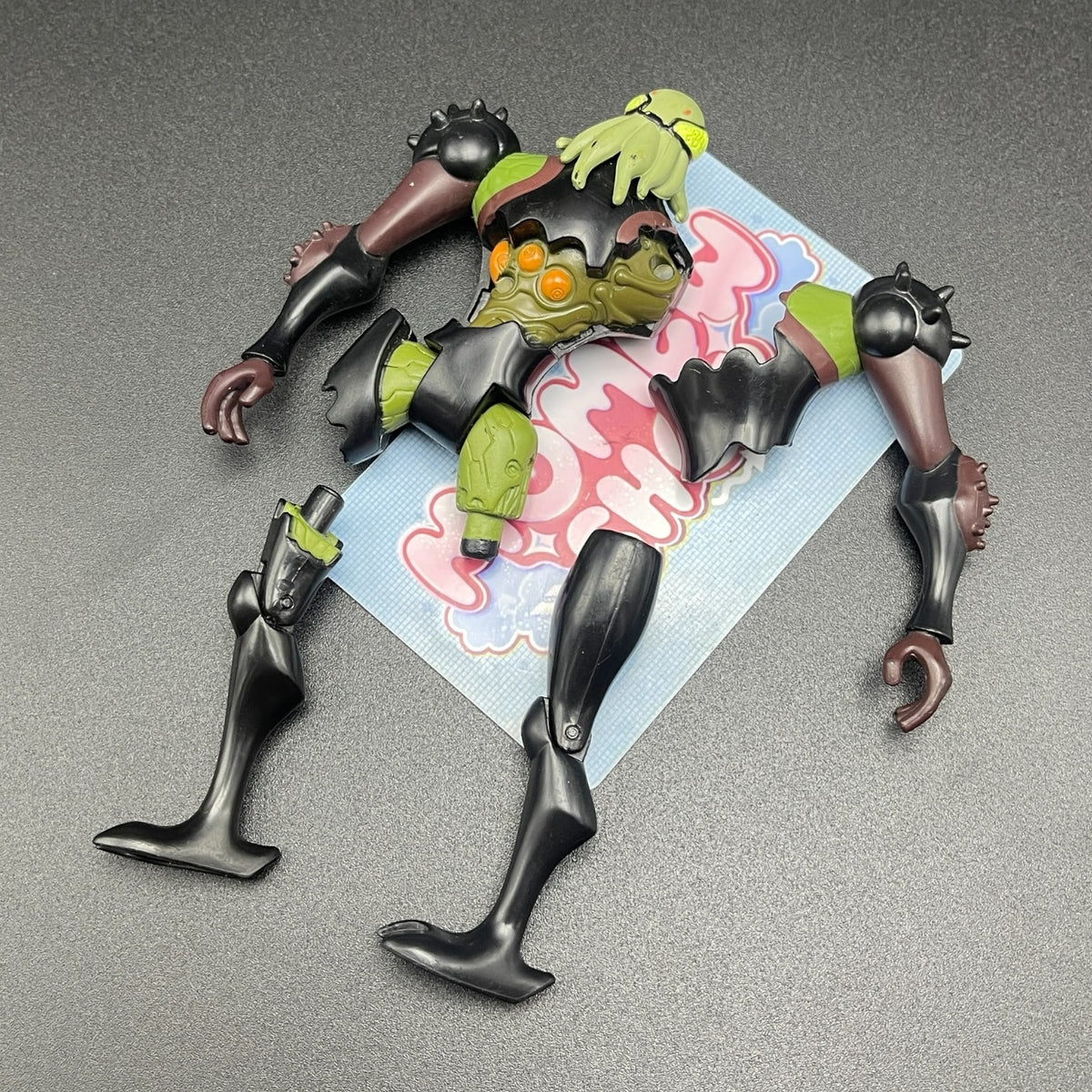 Overhead layout of the classic Vilgax action figure with accessories on display