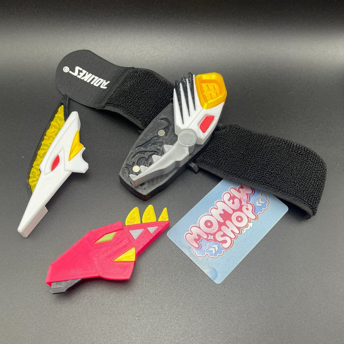 Side angle view of 3D printed White Drago Morpher components and strap.