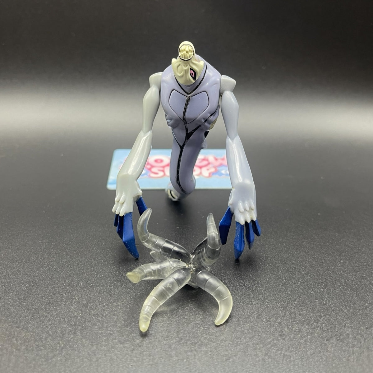 Ben 10 Classic Zs'Skayr action figure laid out with translucent tentacle attachment.